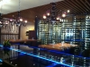 Take a seat at the stunning glass bar inside 8k Restaurant at Viceroy Snowmass