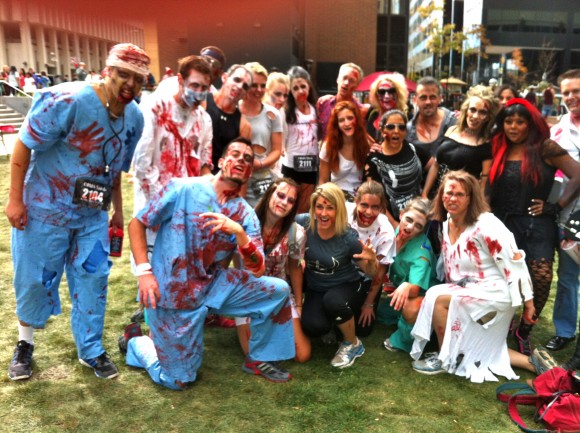 Teams Pose in Zombie Inspired Costumes 