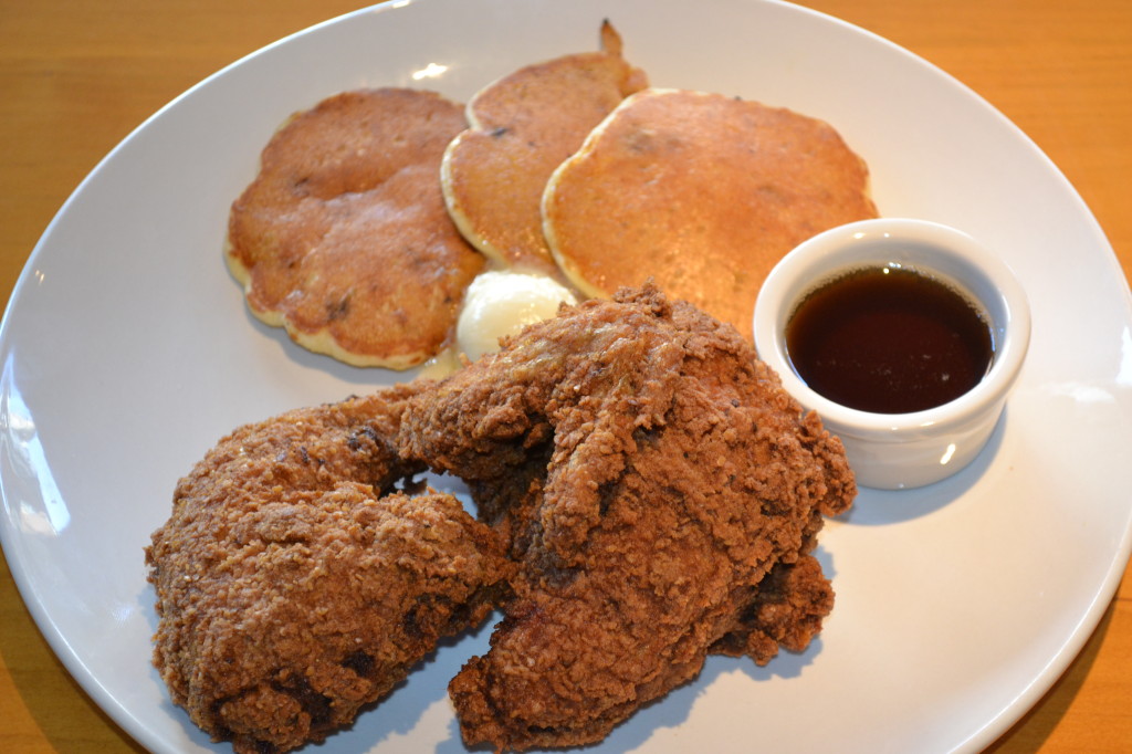 Fried Chickenlooper and Corn Cakes served at Tom's Urban 24 is the restaurants version of chicken and waffles. Co-founder of Tom's Urban 24, Tom Ryan says "We are comfort food with a new spin"