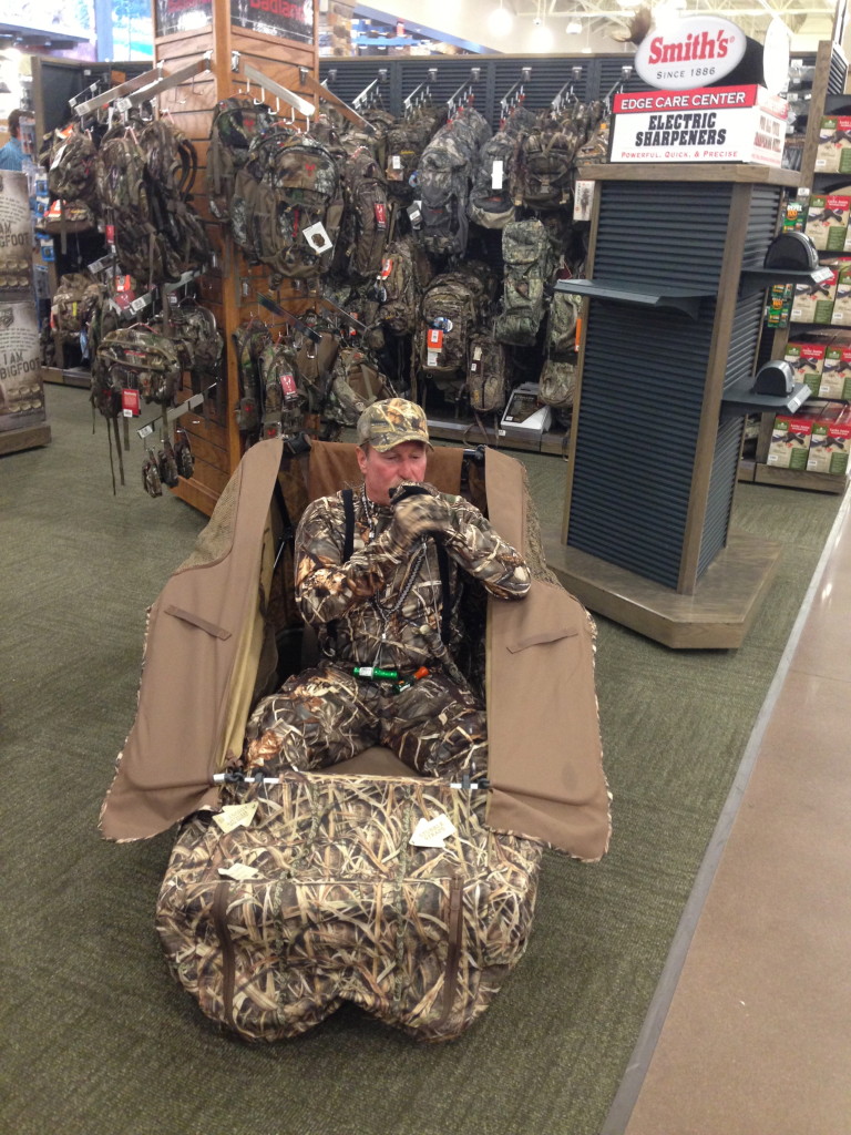 A Cabela's employee practices a duck call inside the store. 